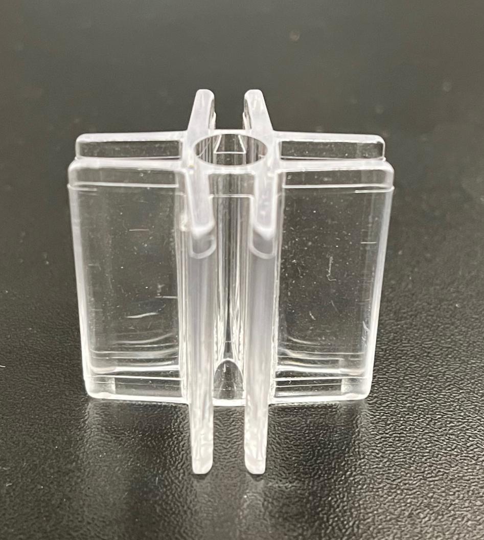 Clear plastic four way glass and plastic shelf holder